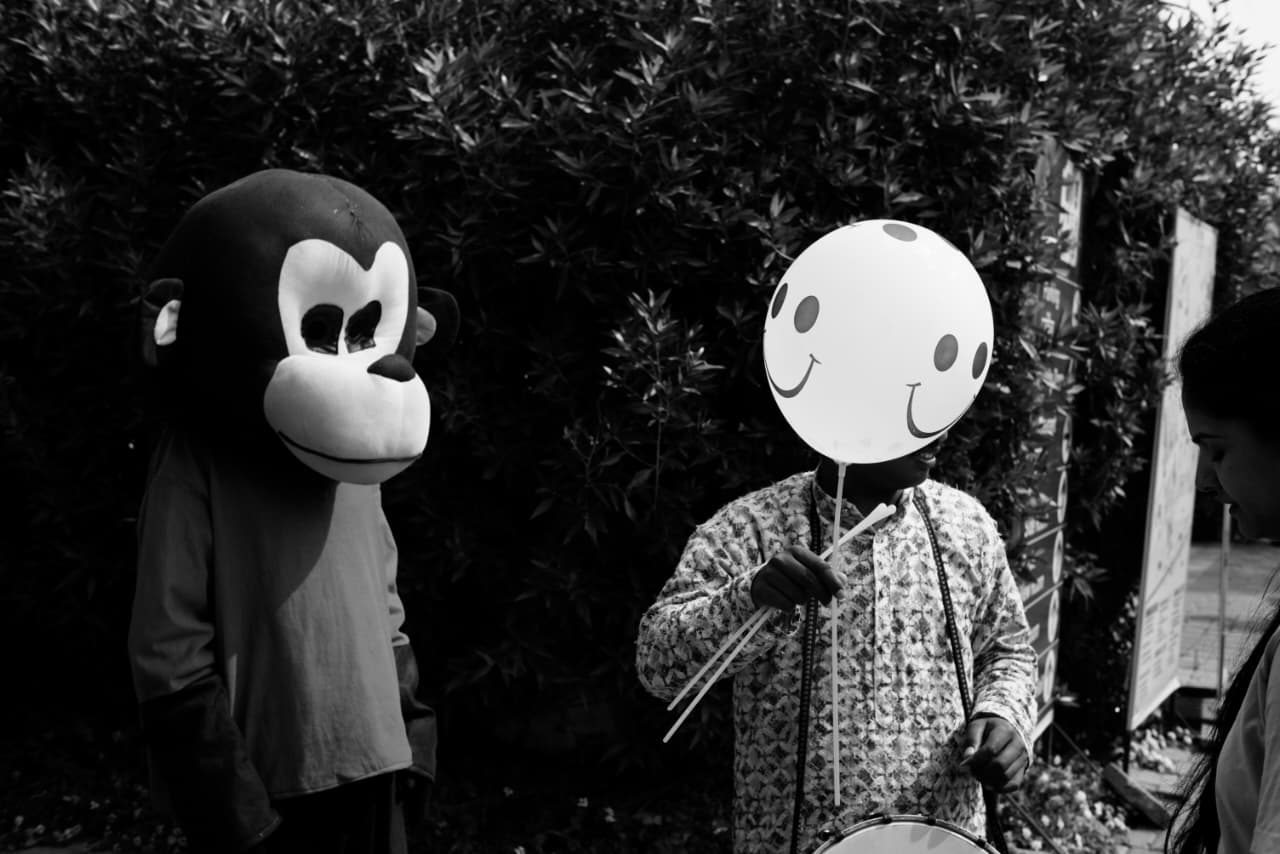 Monkey mask and smiley balloon