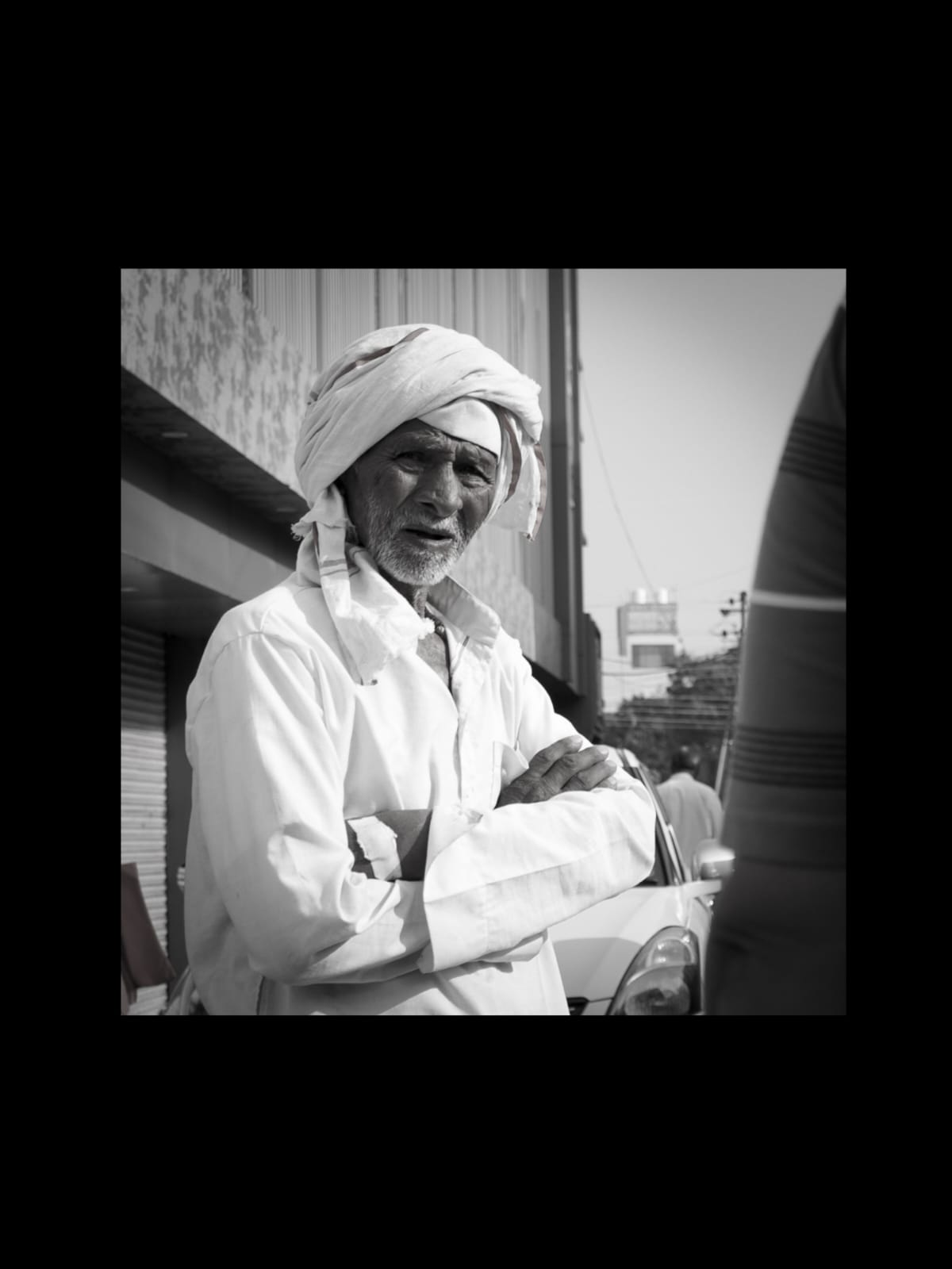Older man with arms crossed